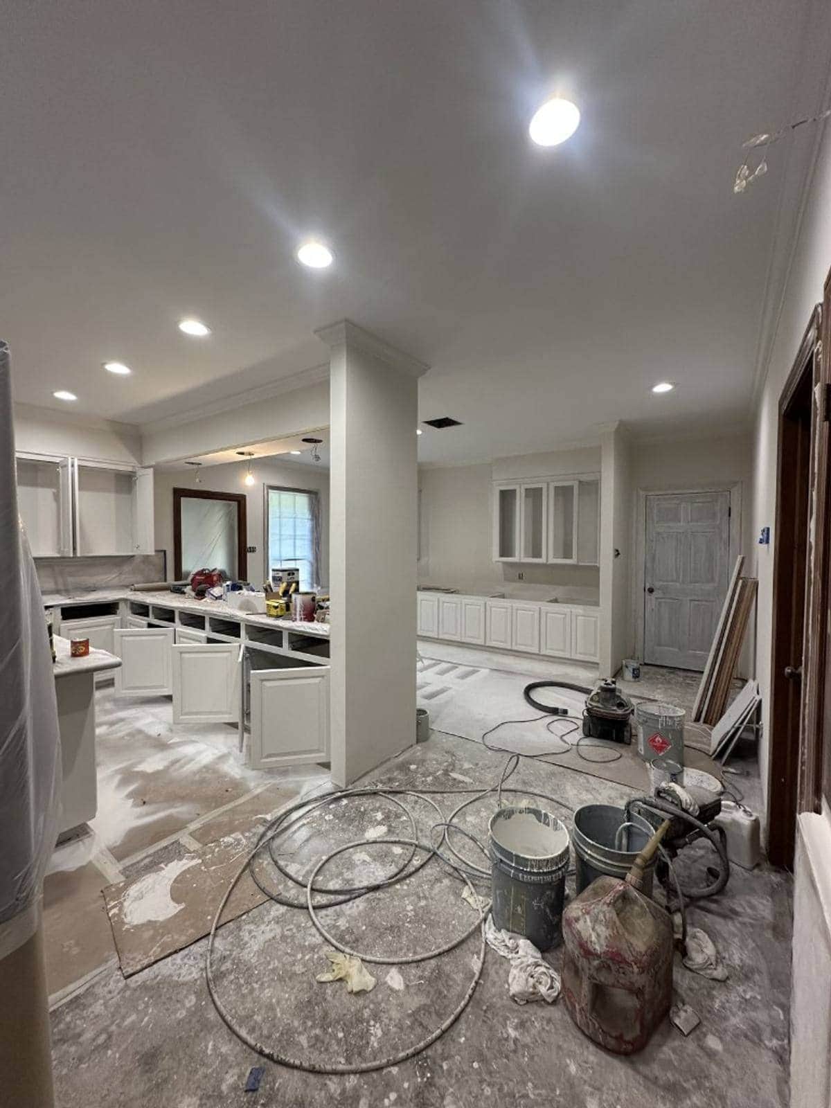 Kitchen mid-refurbishment with dust, tools and debris — the kind of site Sufloria prepares after builders leave